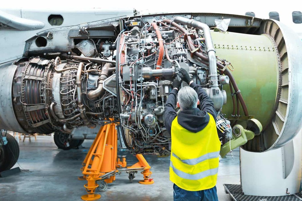 Aeronautics Engineer Conducting Maintenance on Aircraft Engine